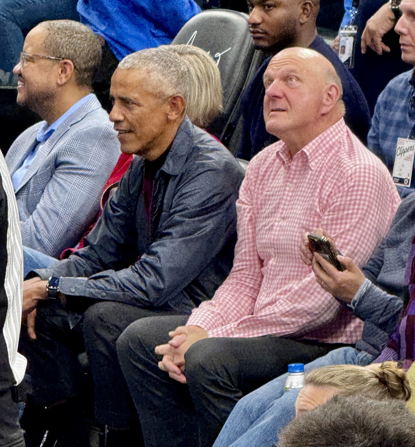 Spectators watching the action from courtside seats